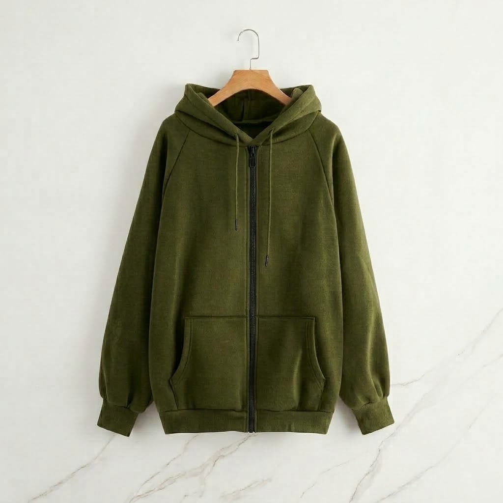 An olive green zip-up hoodie with a drawstring hood and front pockets, hanging on a wooden hanger against a light gray marble-textured wall.